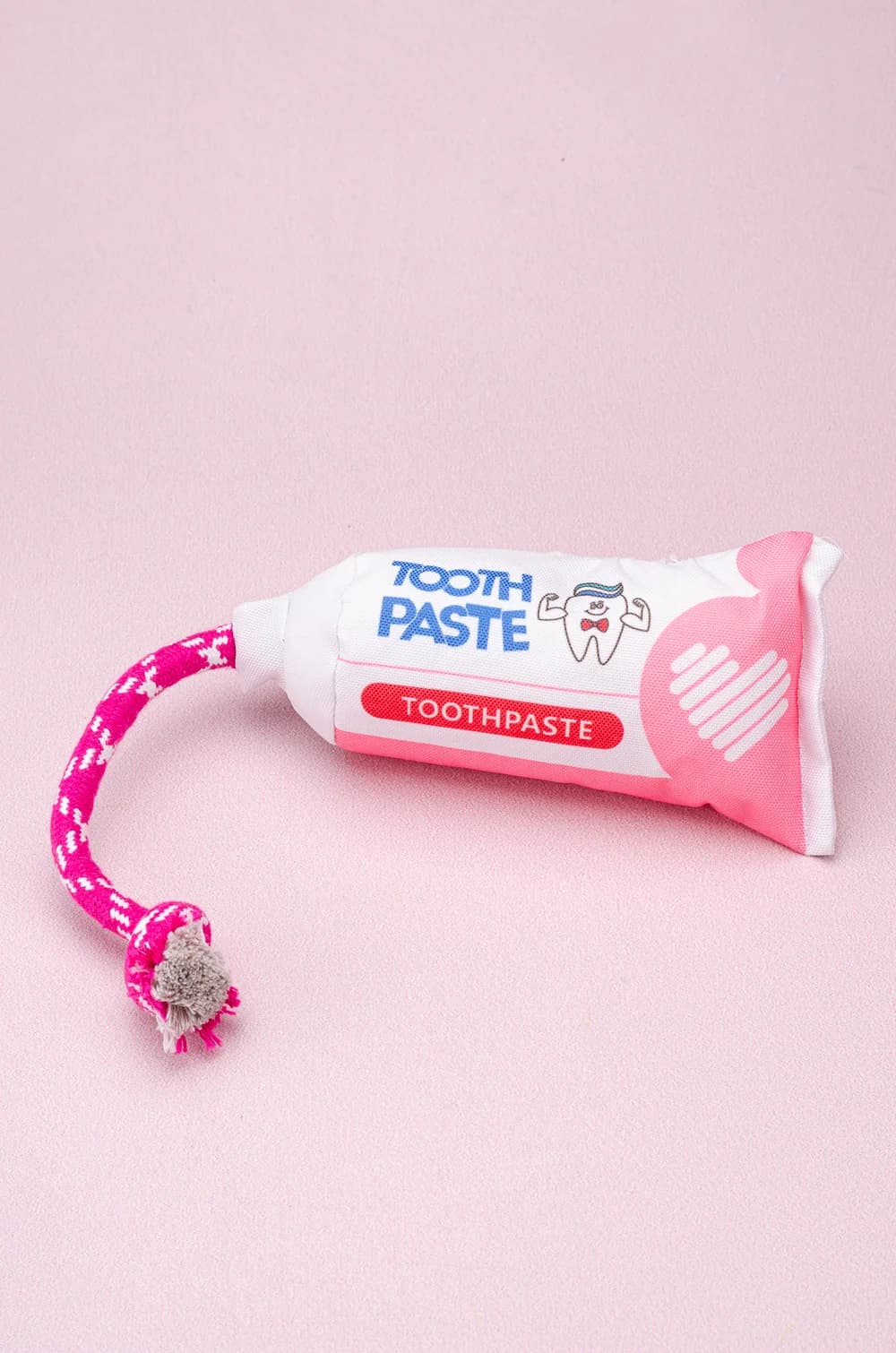 Іграшка для собак мʼяка з пищалкою, шелестом і канатиком «Зубна паста» (35см)